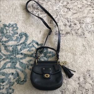 Black mini coach bag with adjustable strap